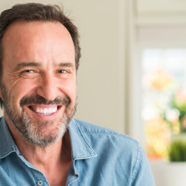 Older man with beard smiling Mullins SC dentist