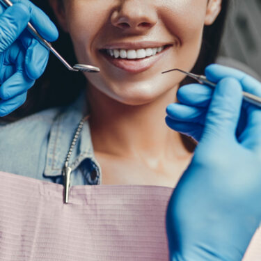 woman in dentist's chair cosmetic bonding